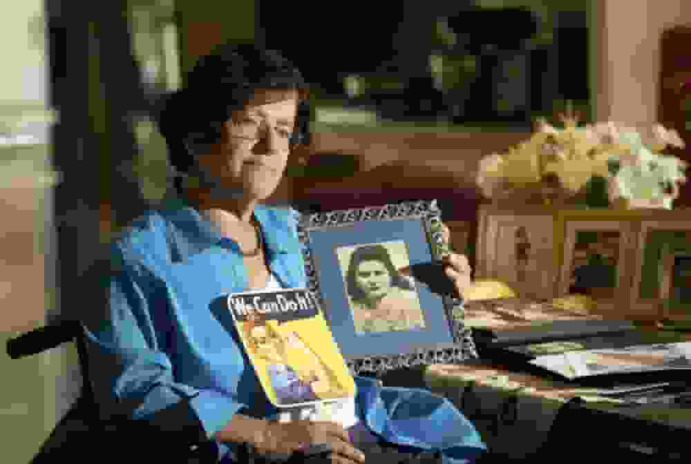 Dorene holding a photo of her mother Primetta