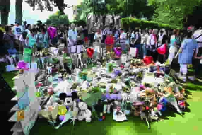 People gathered in a park in the French Alps town of Annecy on Sunday to show their unity and support for the victims of a playground stabbing attack. (Photo: Arab News)