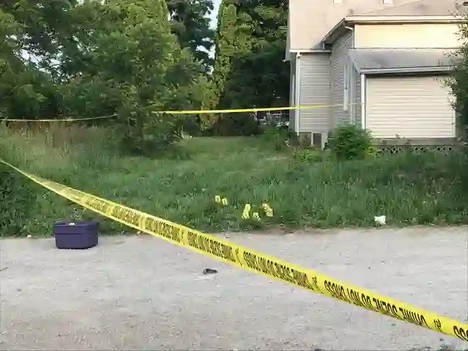 The scene following the block party shooting in Muncie Indiana was chaotic, with photographs revealing multiple bullet markings on the street. (Photo: USA Today)